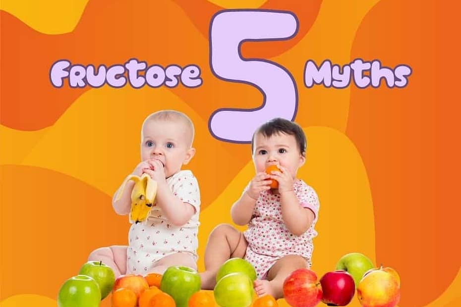 two babies eating fruit
